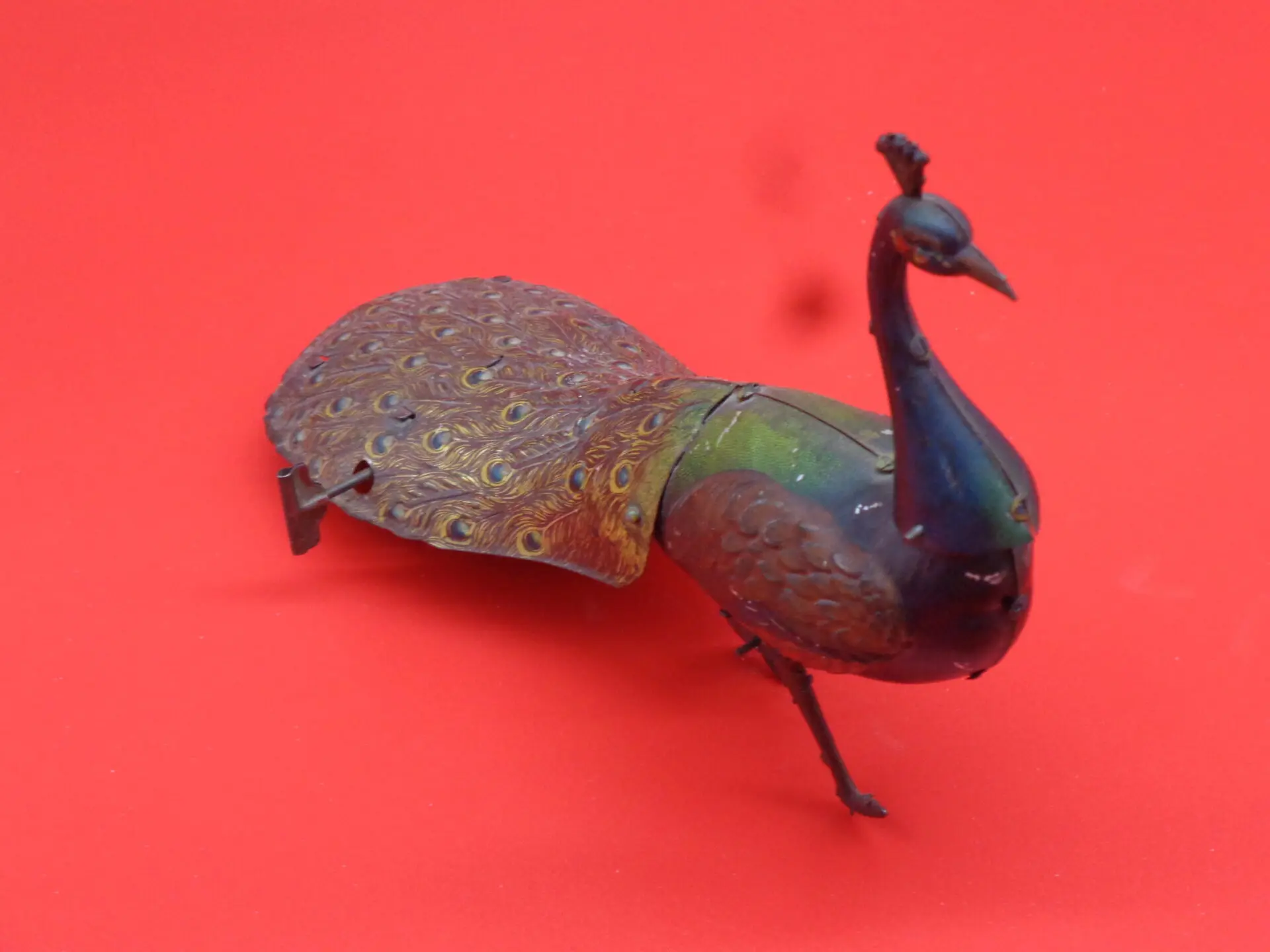 Vintage wind-up peacock toy