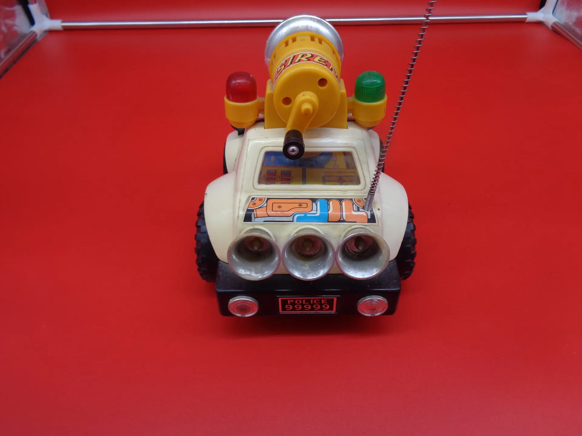 Back of a vintage police toy car