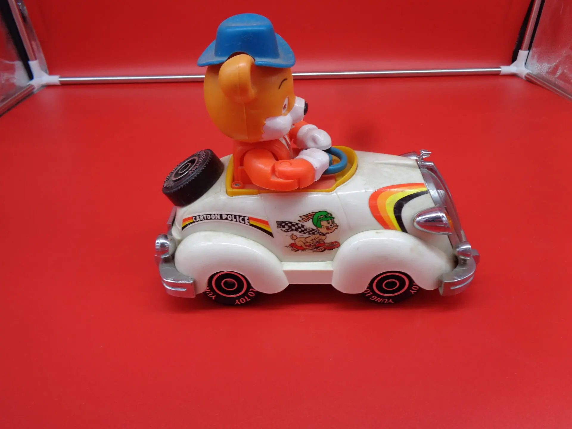 Vintage toy car with a fox