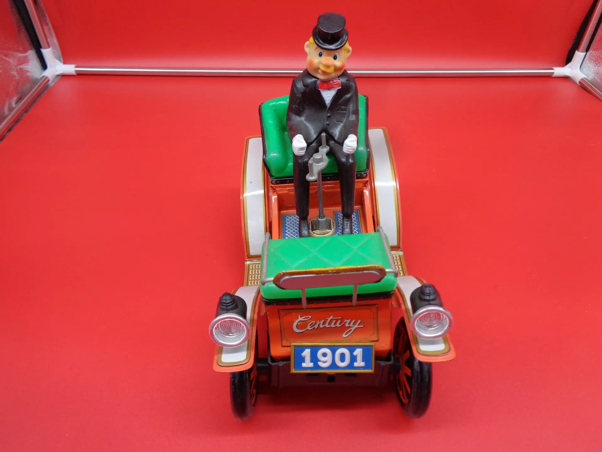 Vintage toy car with a man