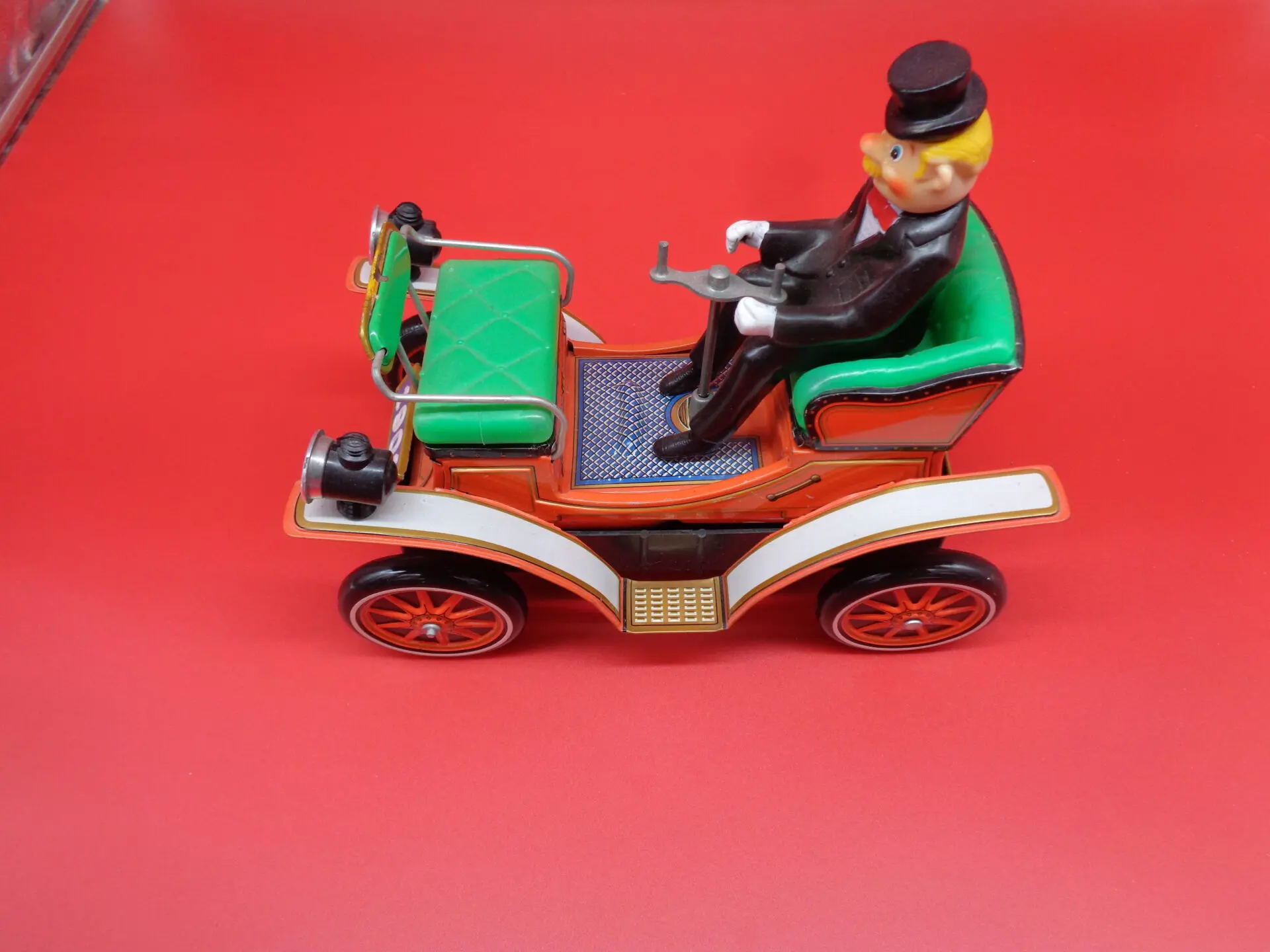 Vintage toy car with a man