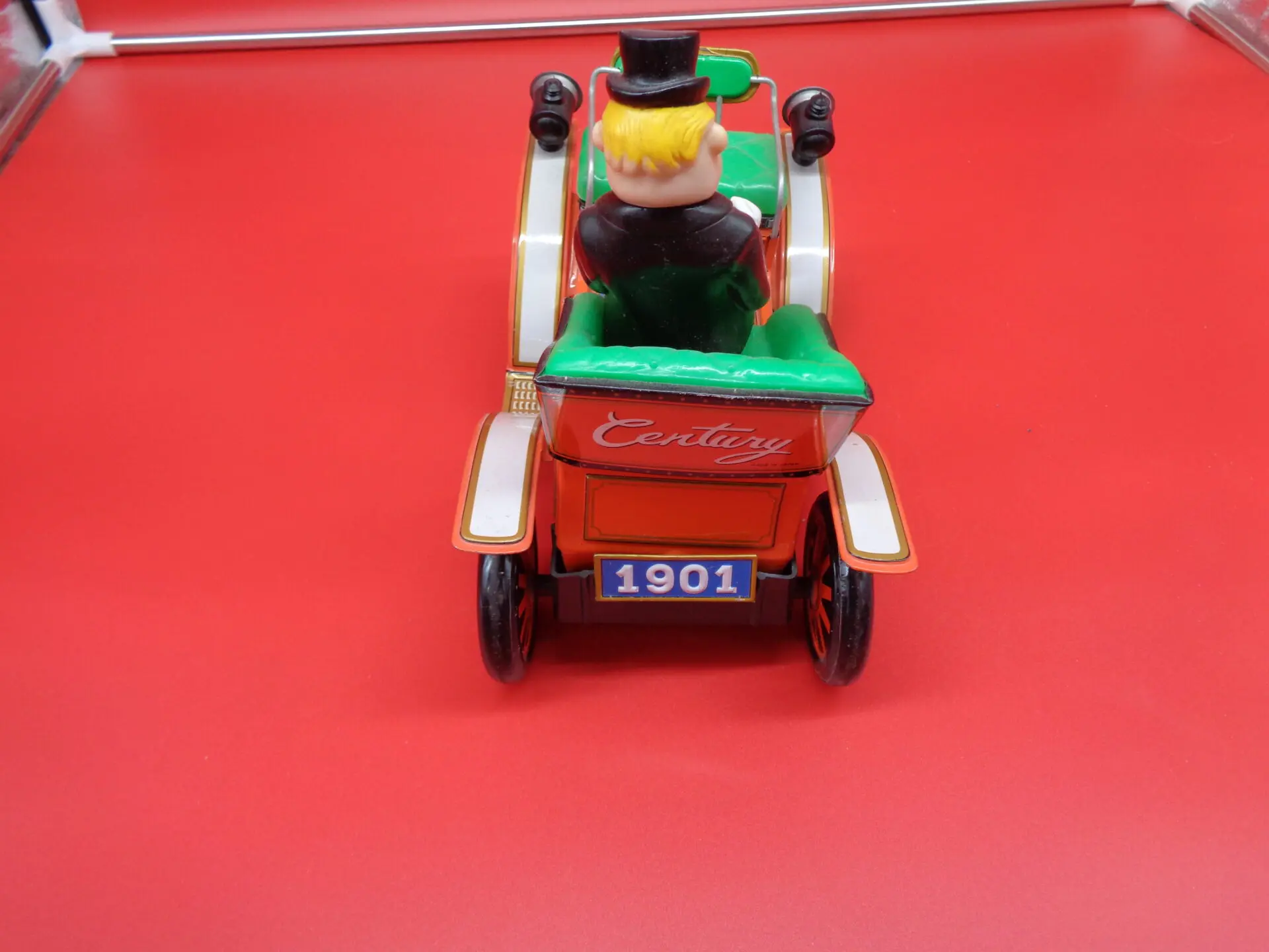 Vintage toy car with a man