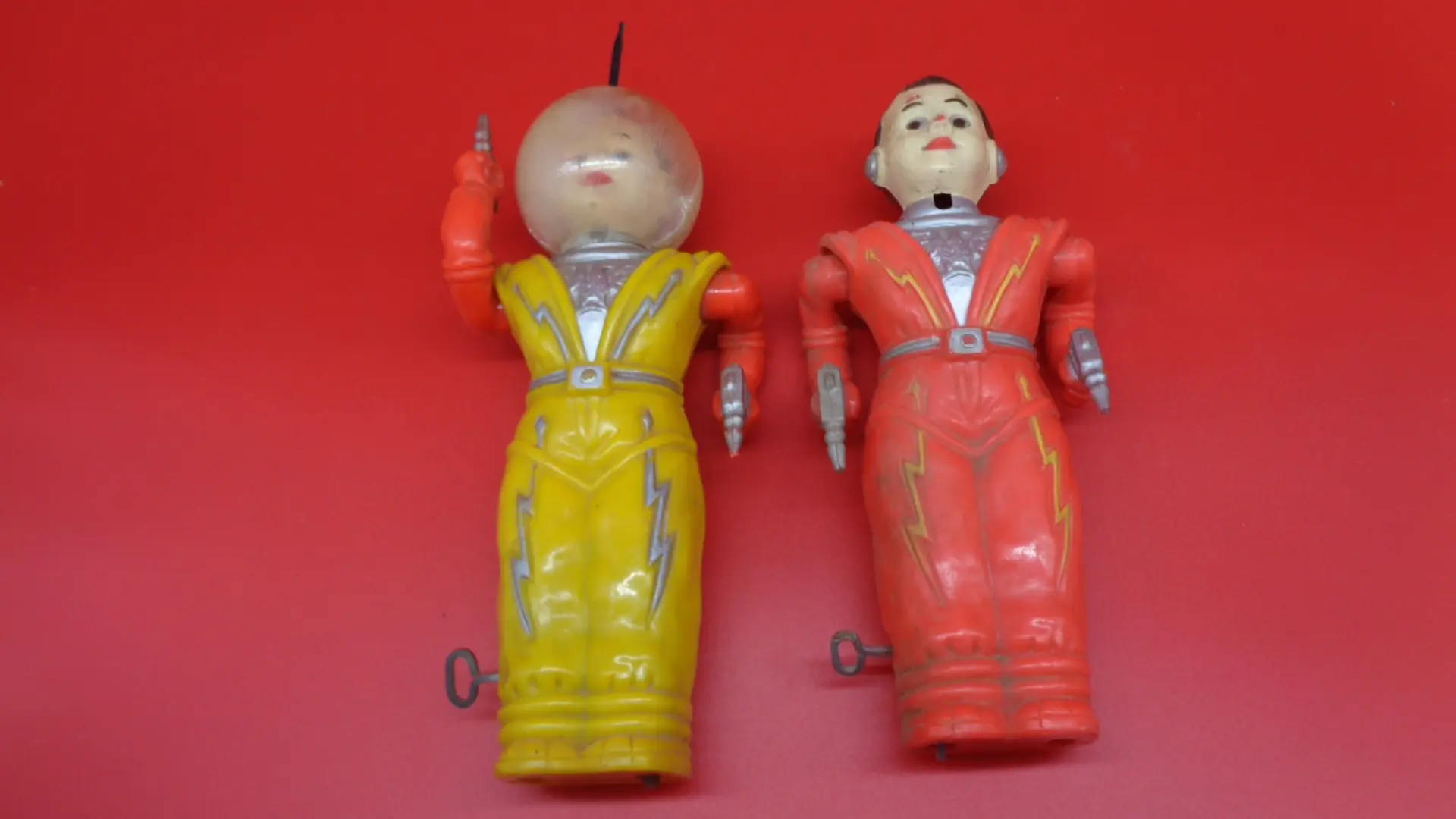 Yellow and orange wind-up spacemen