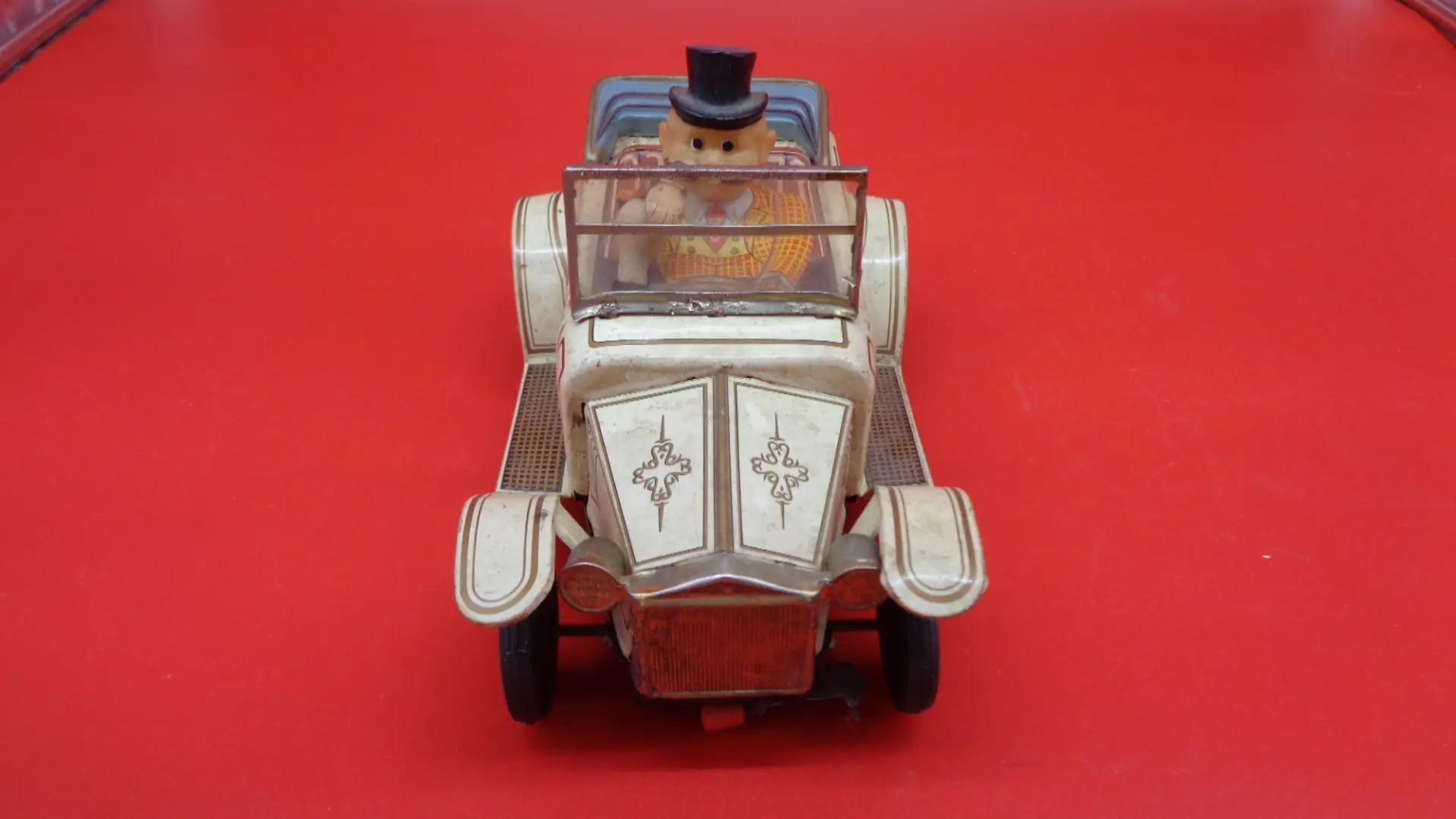 Vintage toy luxury car with a man