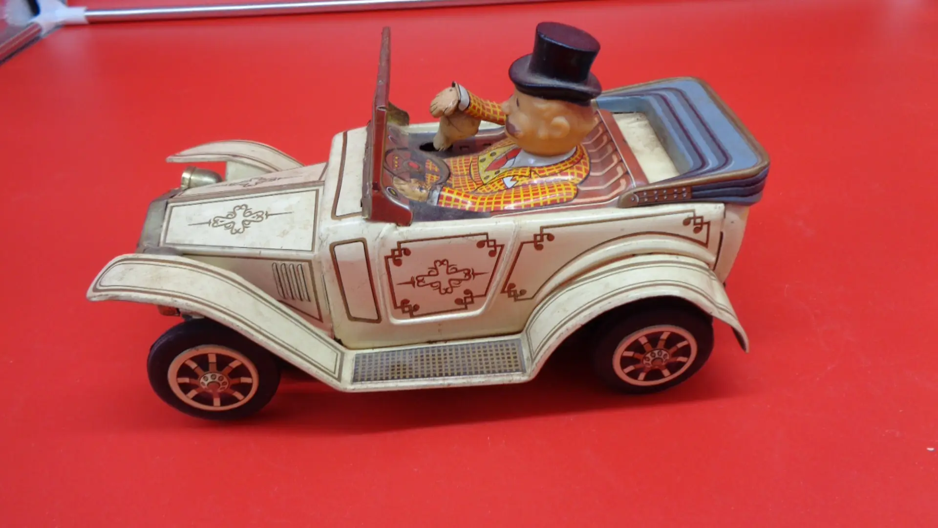 Vintage toy luxury car with a man