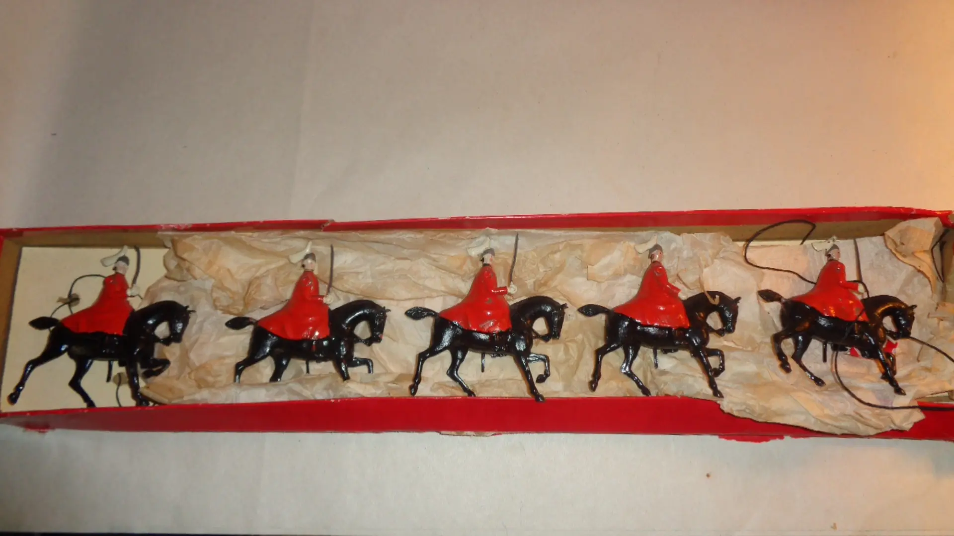 Toy cloaked men on horses