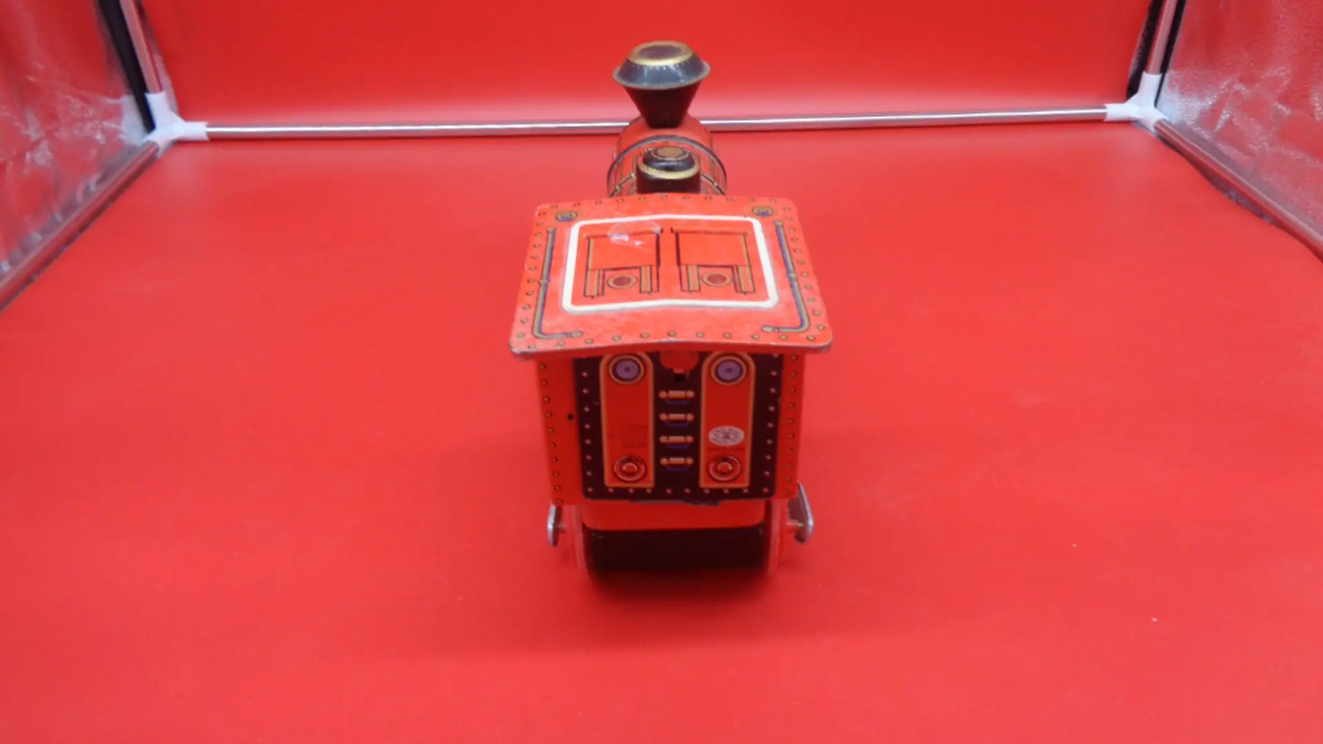 Back of a red vintage toy steam train