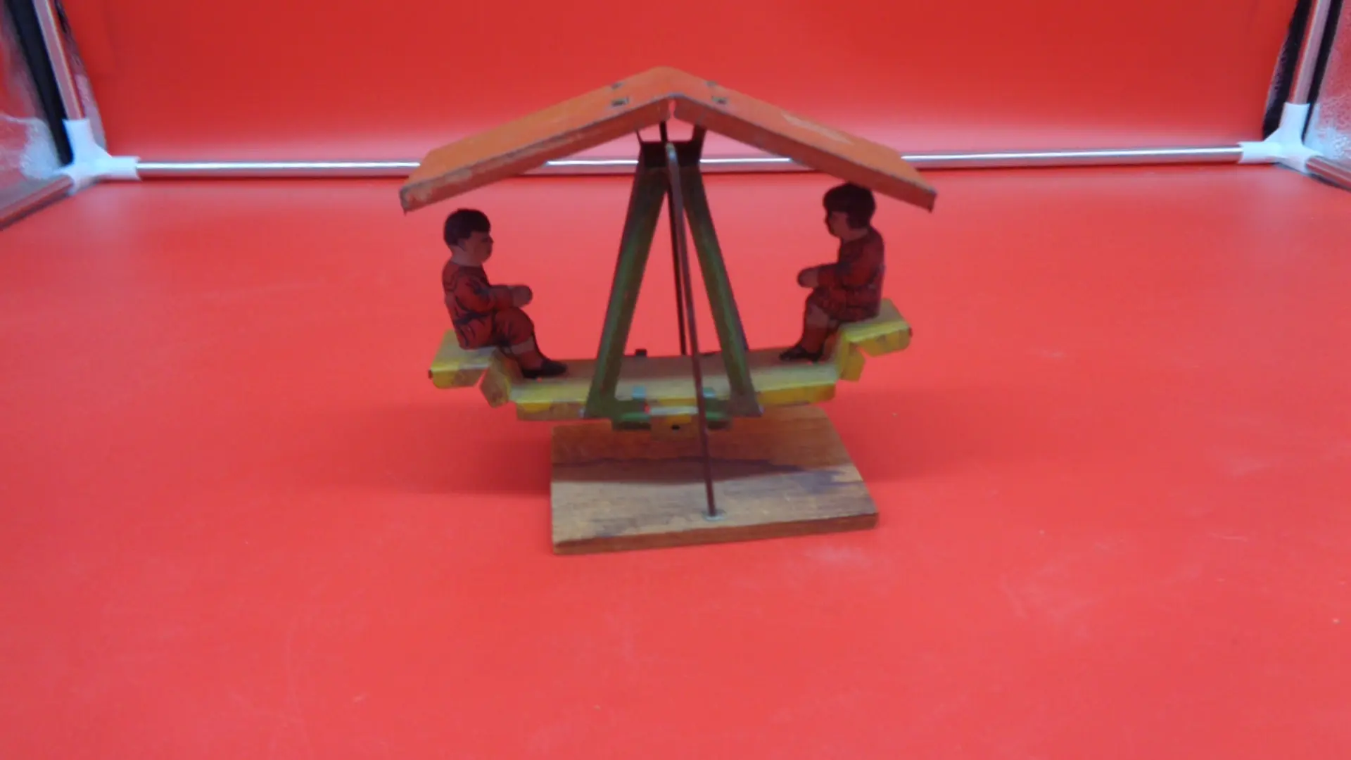 Vintage roofed swing toy