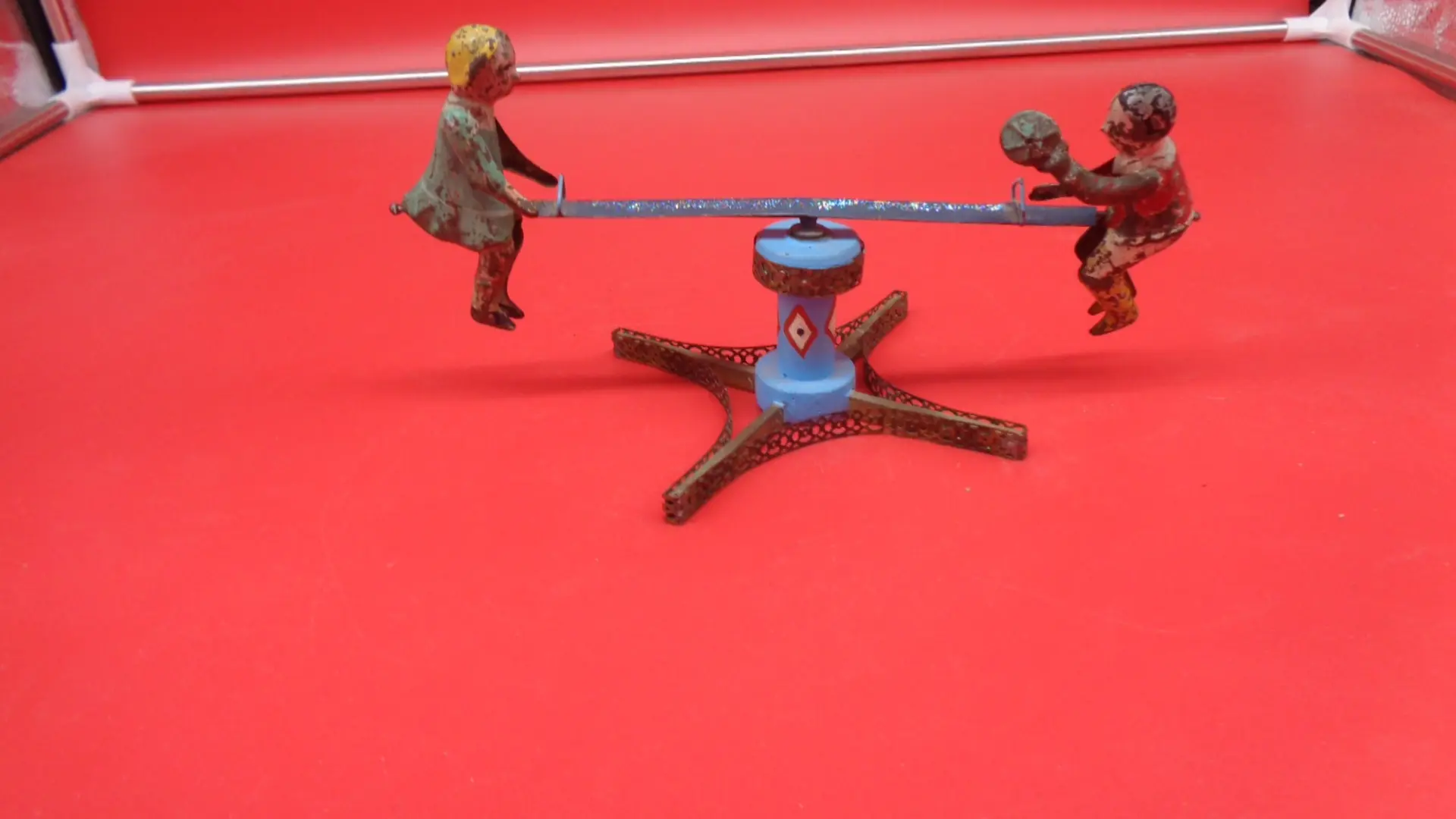 Small, vintage see-saw toy