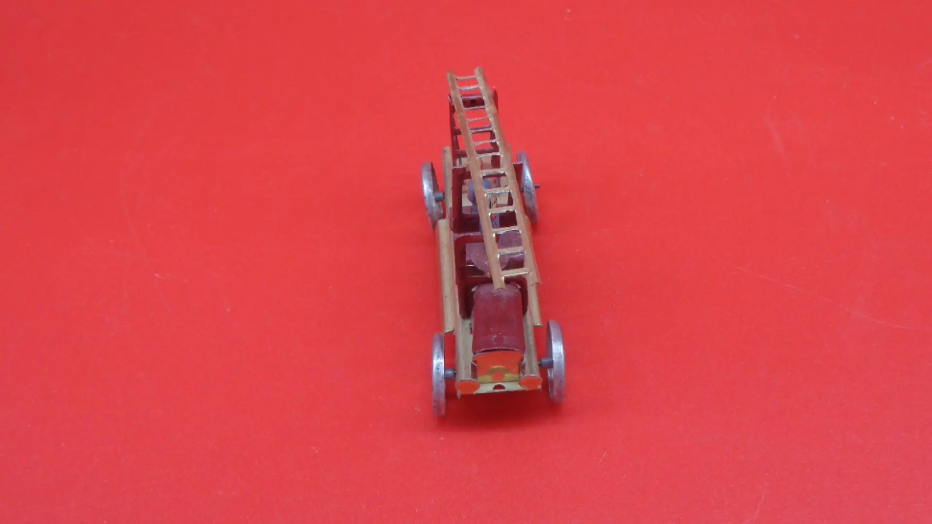 Miniature, vintage old-fashioned firetruck toy