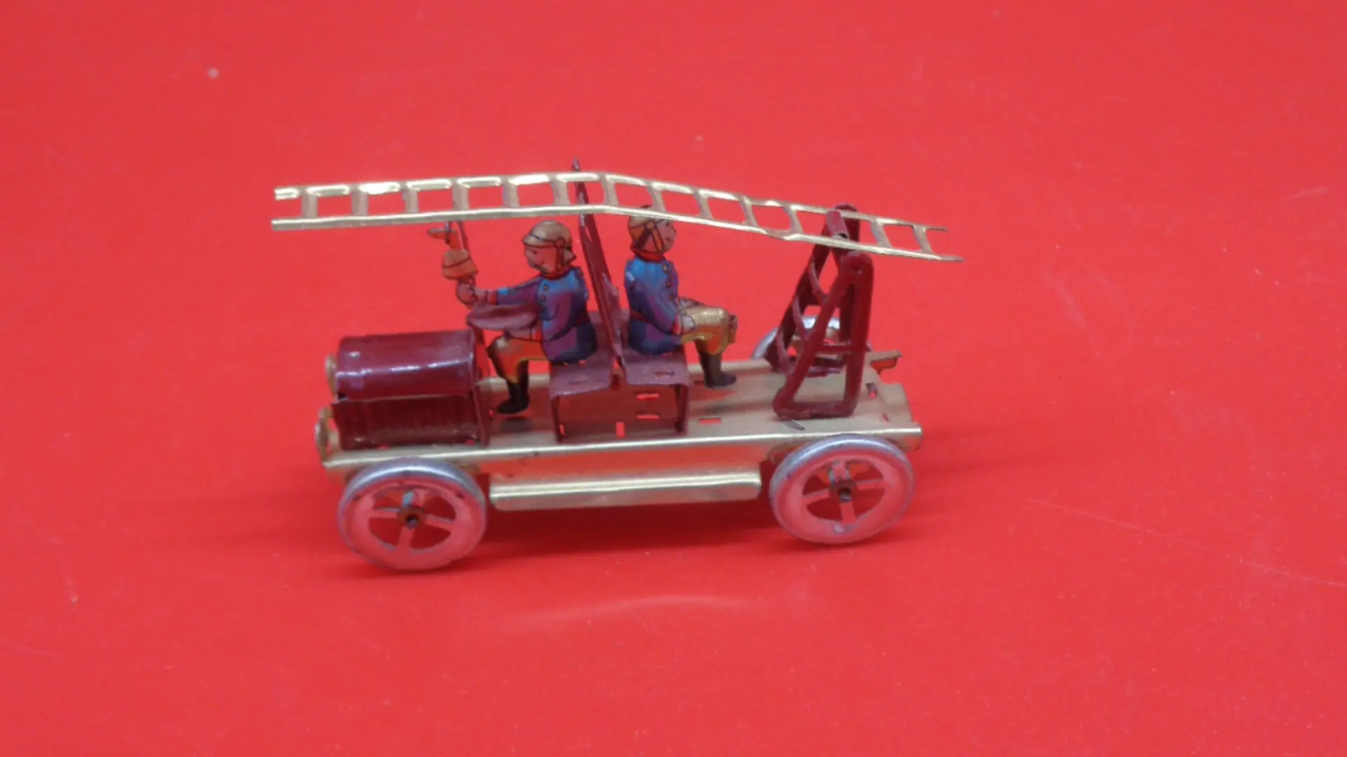 Miniature, vintage old-fashioned firetruck toy