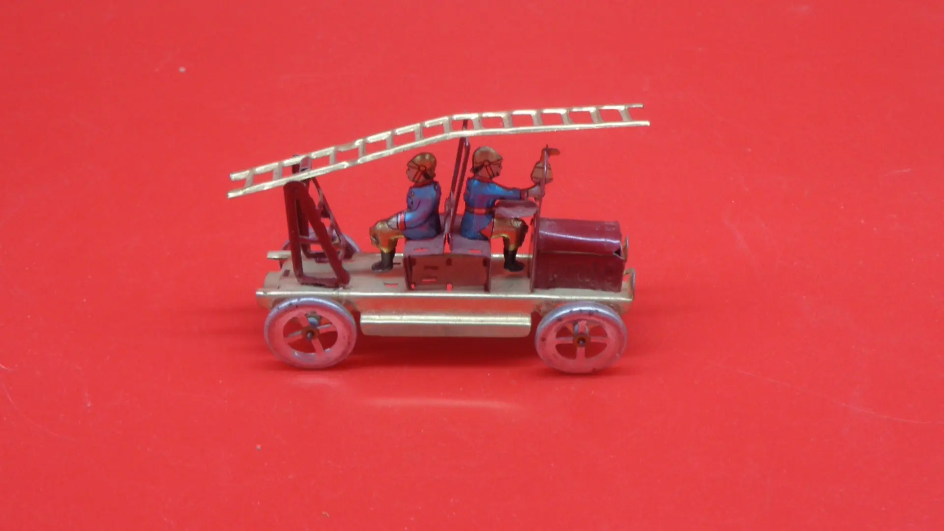 Miniature, vintage old-fashioned firetruck toy