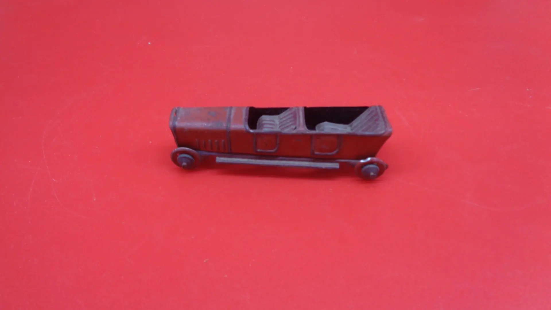 Miniature, vintage roofless toy car