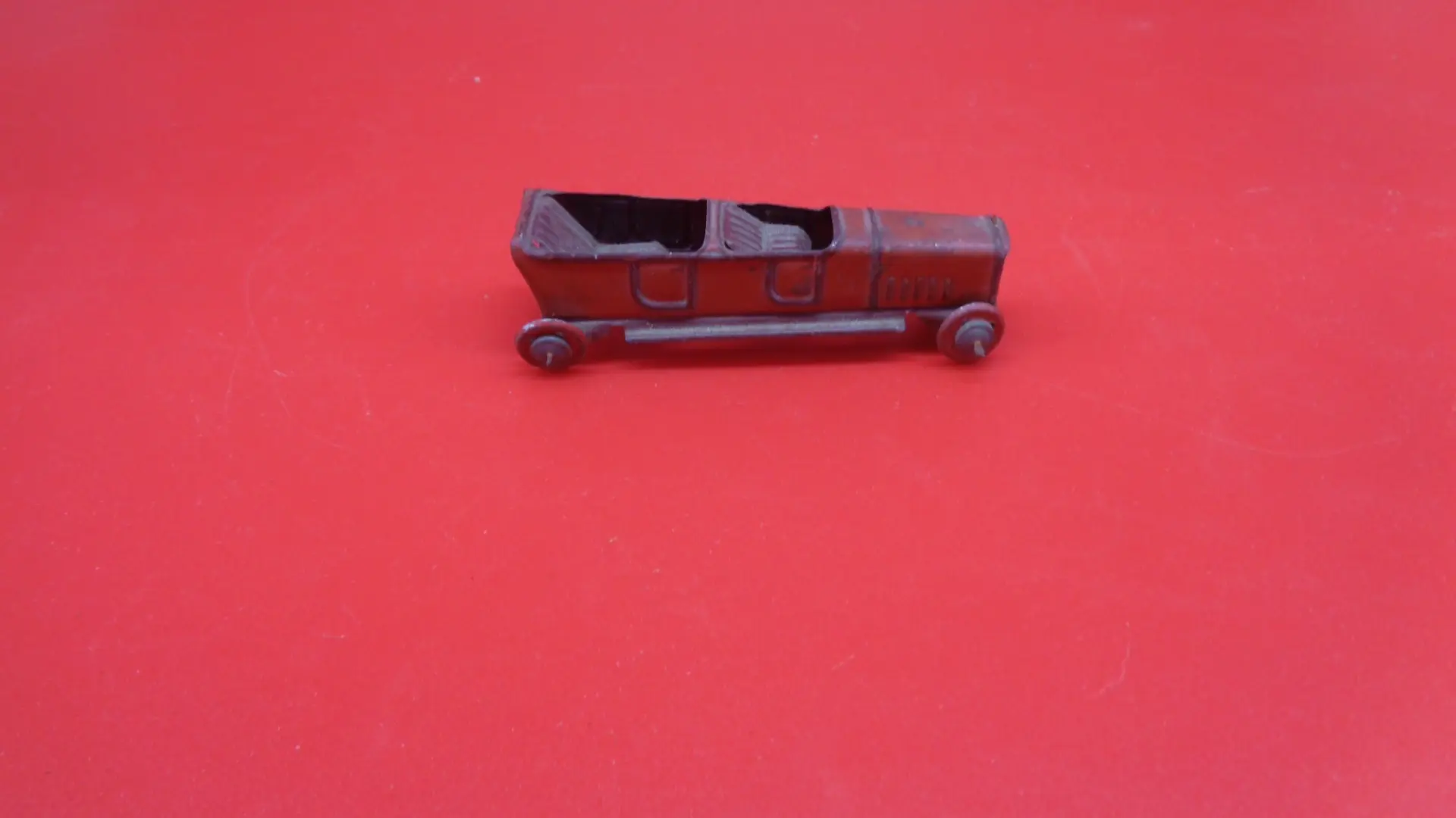 Miniature, vintage roofless toy car