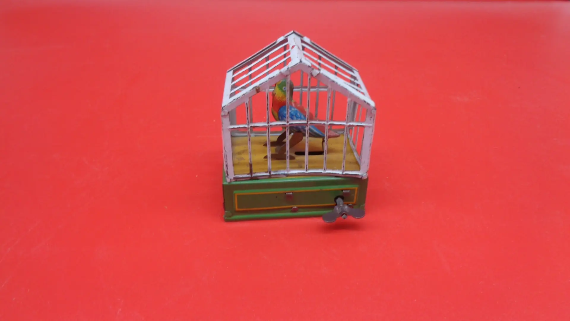 Bird on a cage wind-up toy