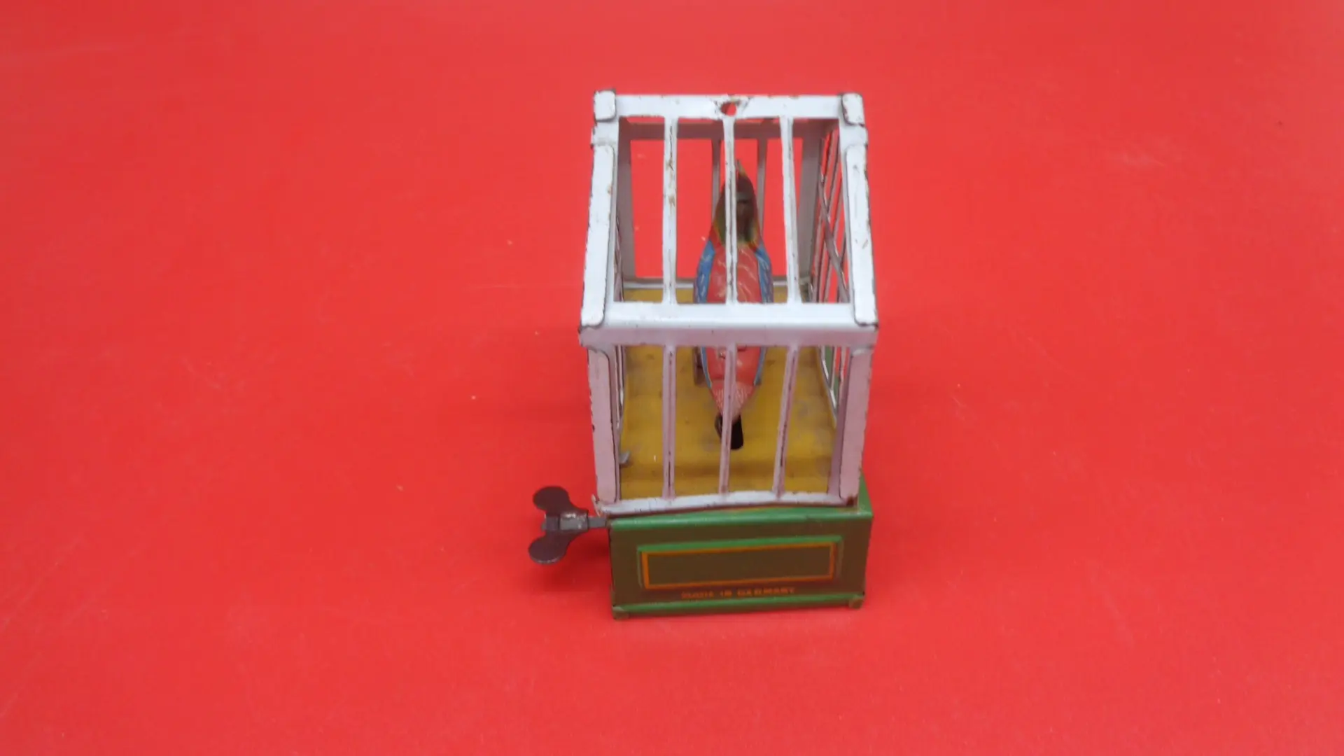 Bird on a cage wind-up toy