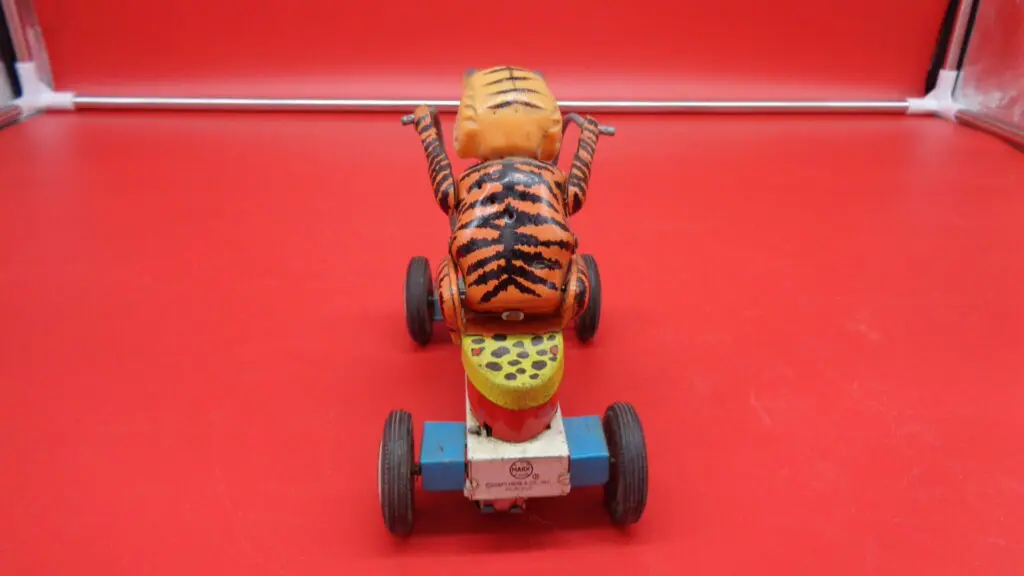 A toy tiger in a motorcycle