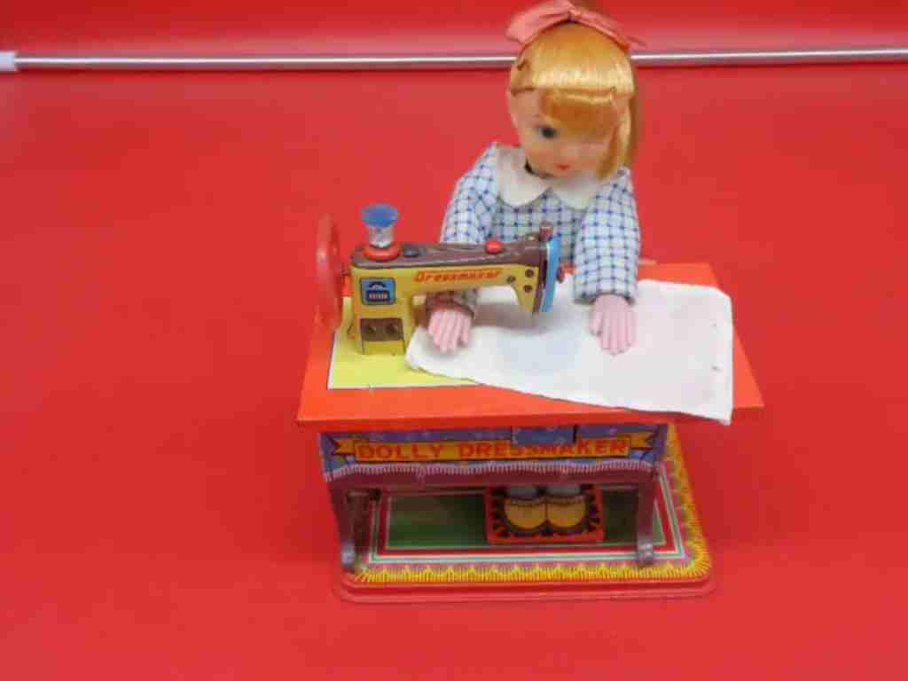 Battery-operated toy, seamstress sewing