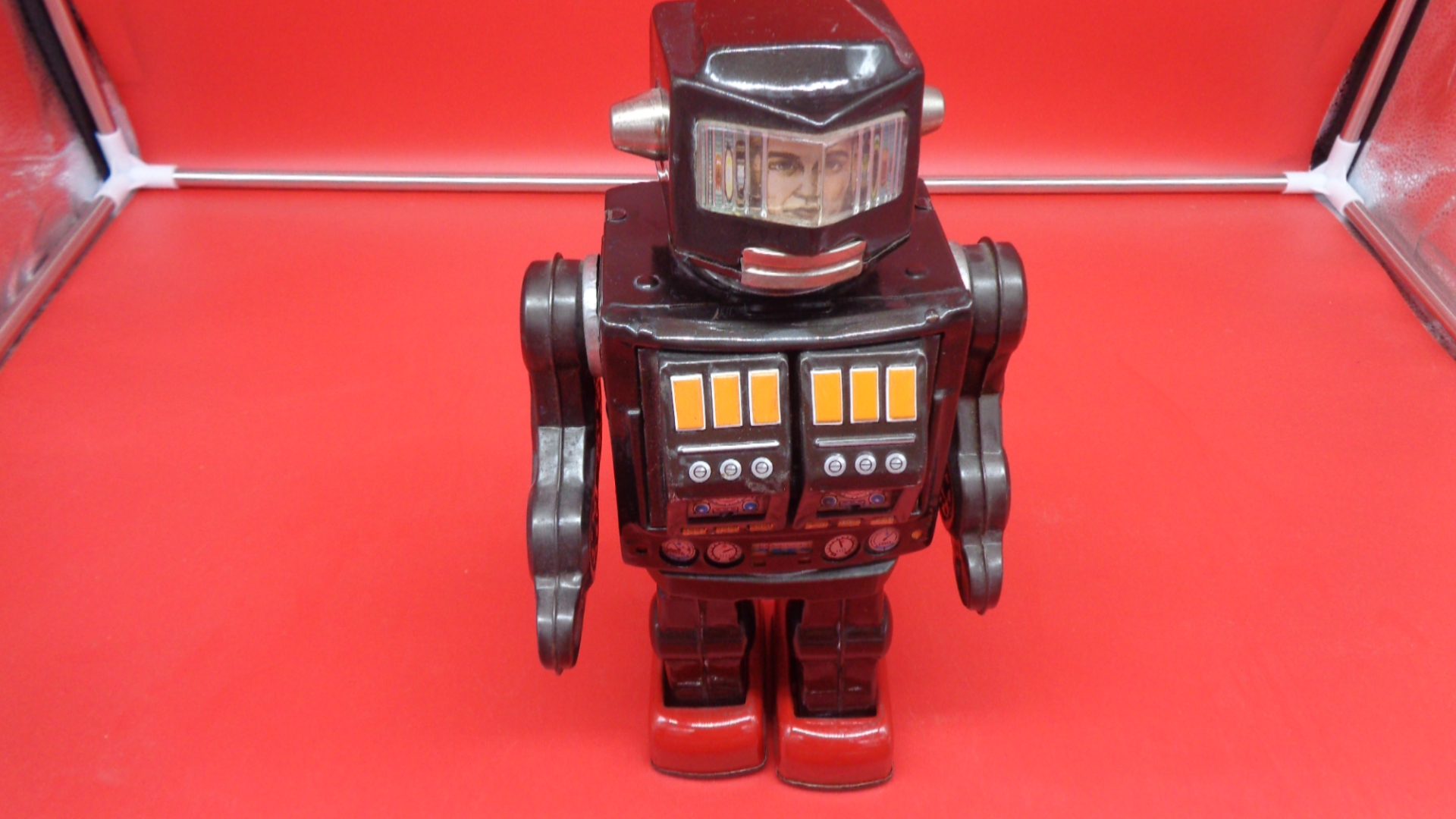 Black toy robot, front view