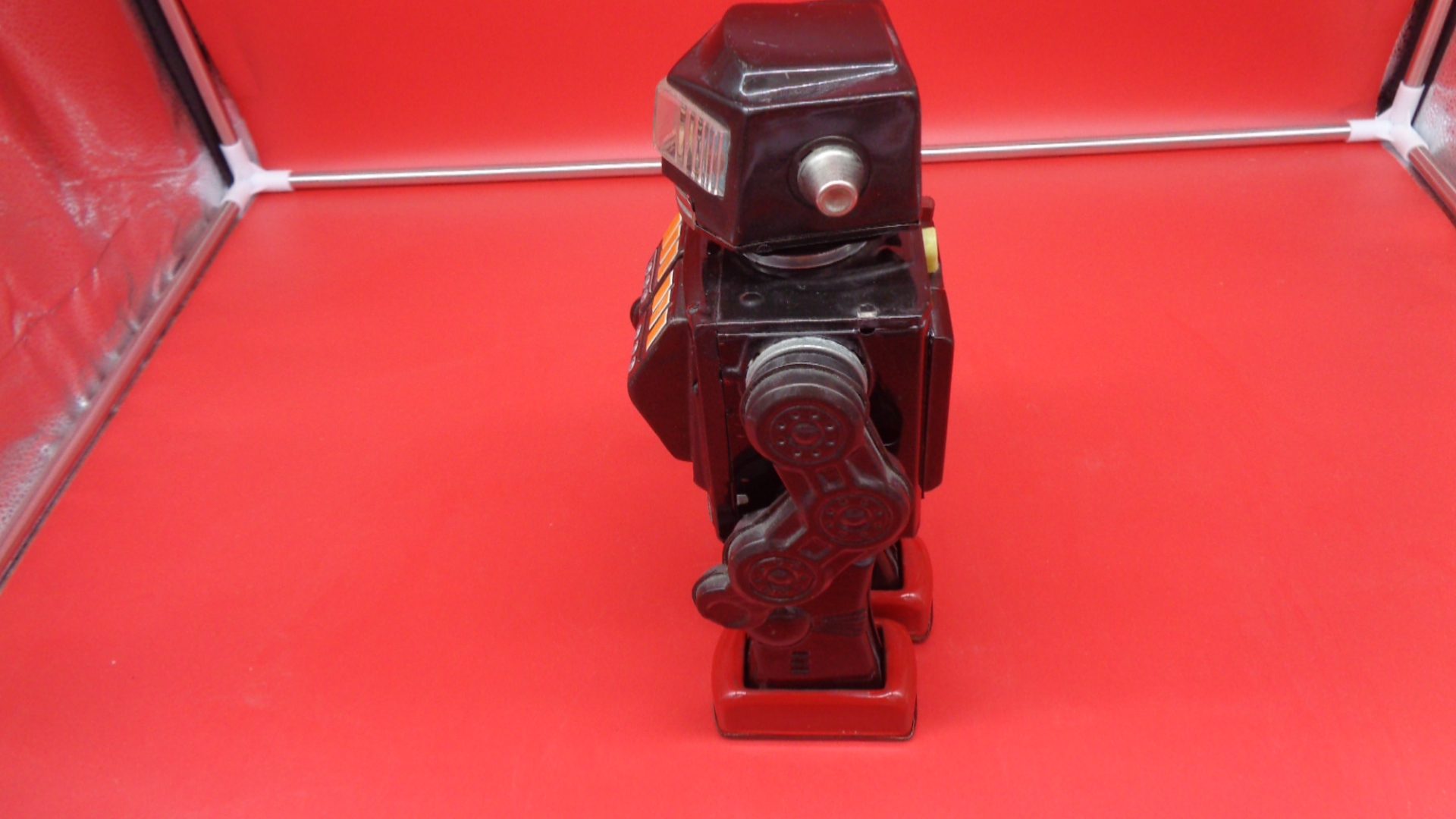 Black toy robot, left view