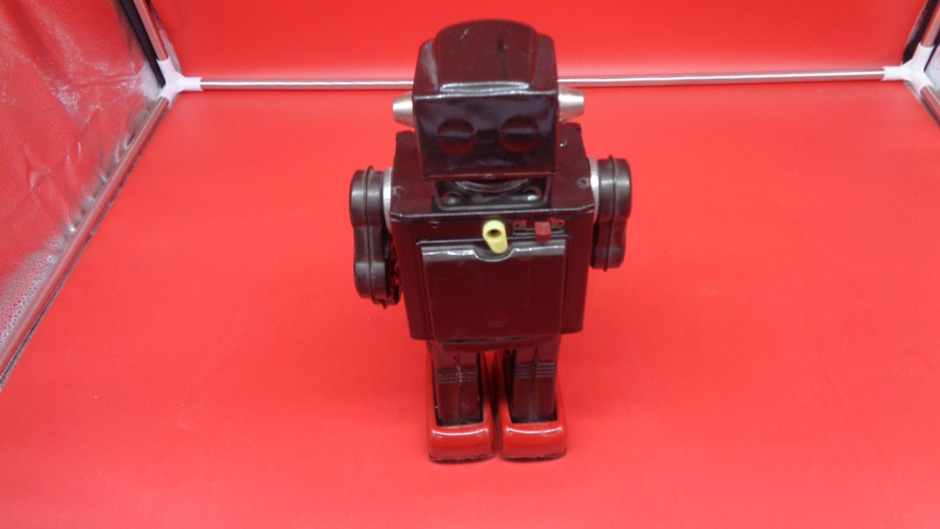 Black toy robot, back view