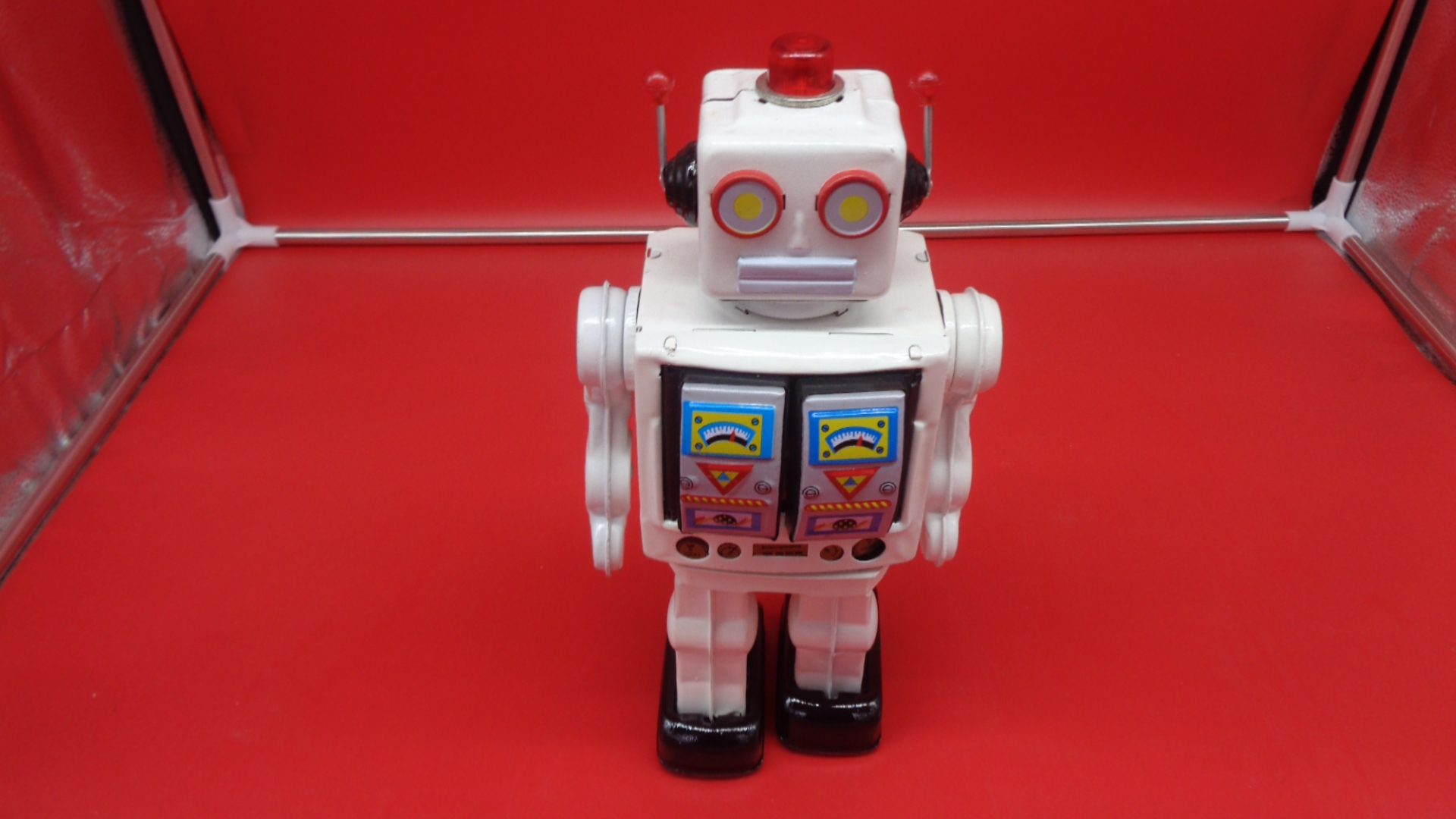 White toy robot, front view