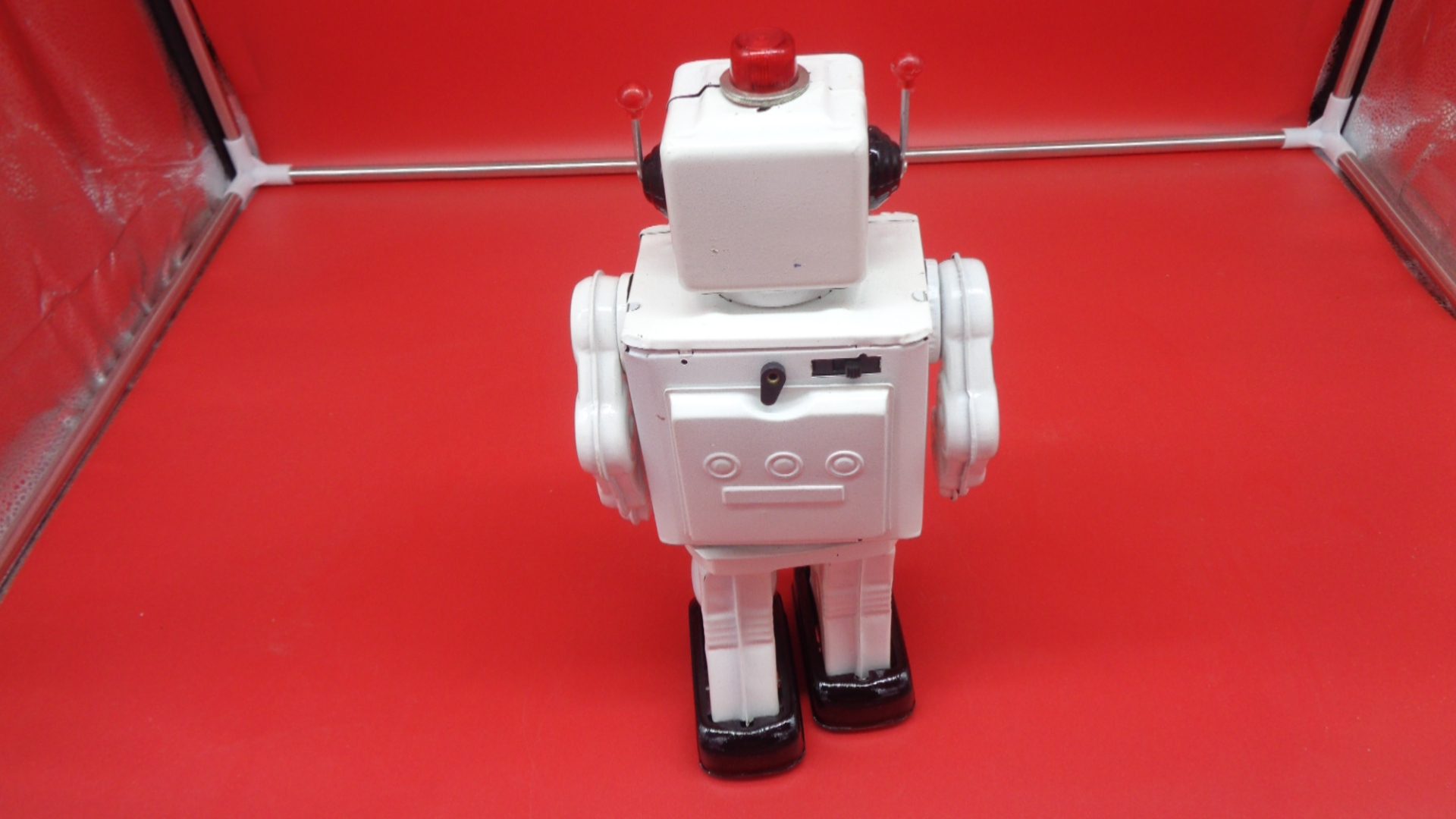 White toy robot, back view