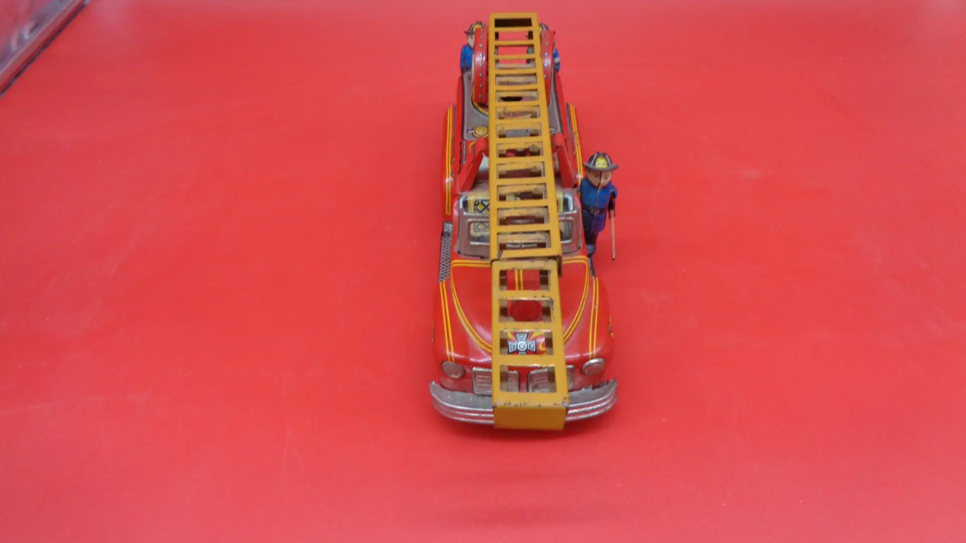 Front side view of Vintage SSS Ladder Fire Truck Tin Litho