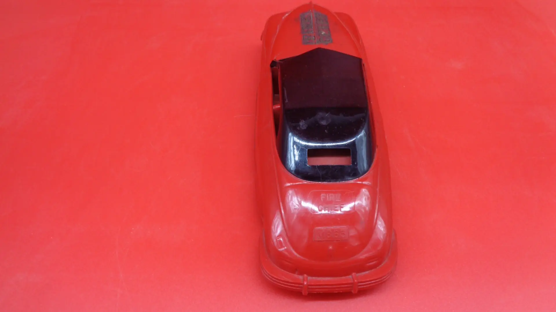 Display of Vintage red colored Fire Chief plastic car toy