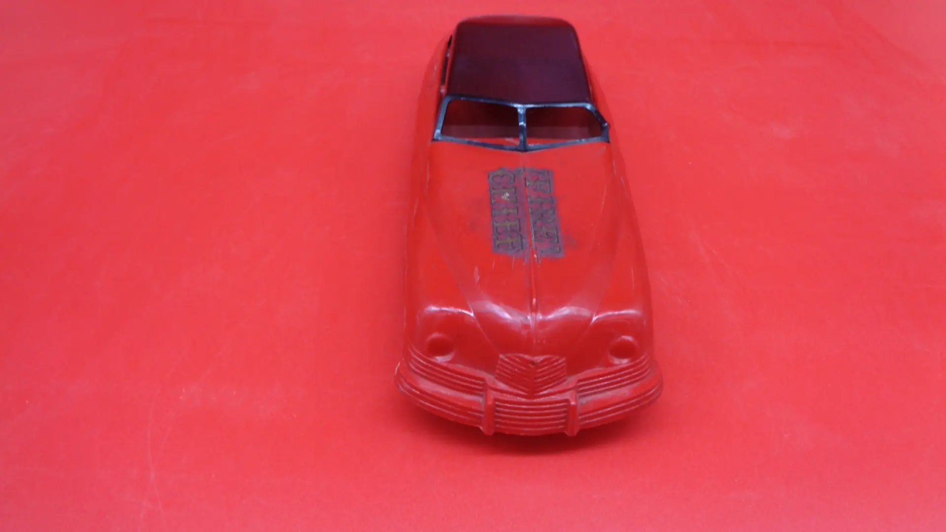 Vintage red color Fire Chief plastic toy car front side view