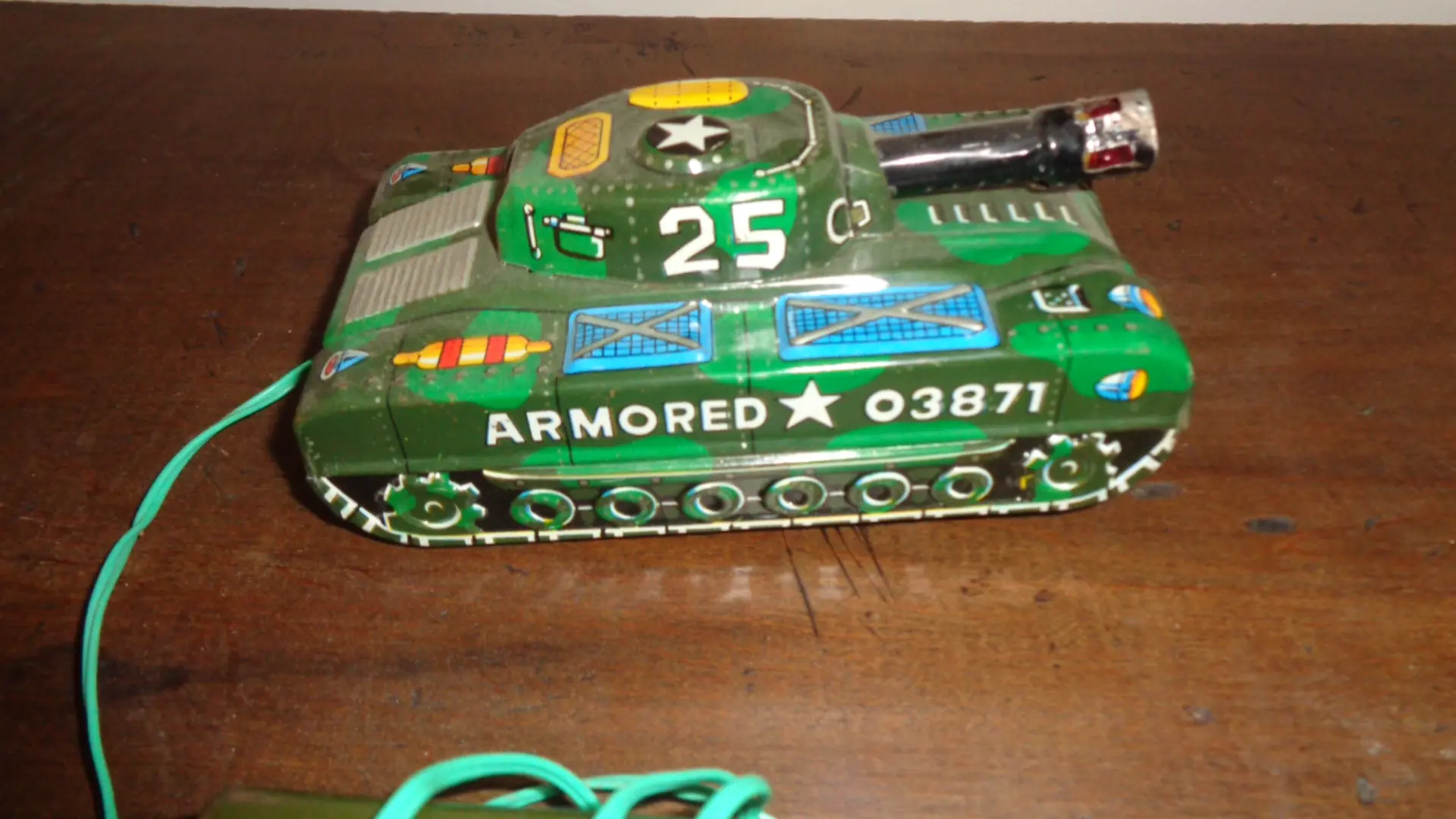 Green Vintage Military Tank showing Armored 03871 and wire