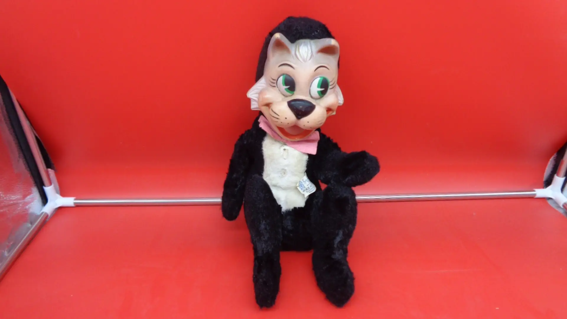 Display of front view of Vintage Plush Mr. Jink Cat